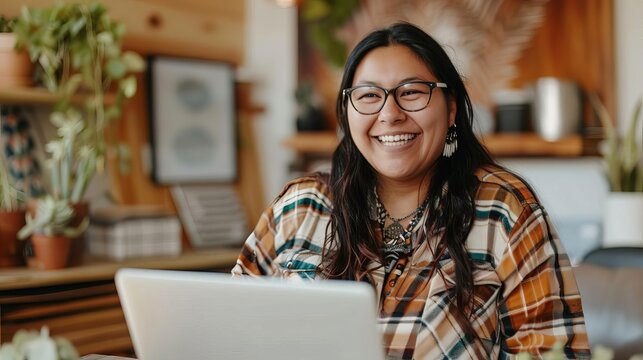 happy native american woman working remotely laptop video call diversity and inclusion