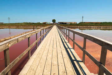 Main board walk and entrance area of the Burgas Salt Pans, a group of salty pink pools at...