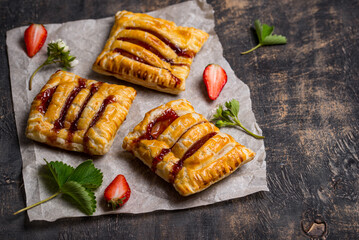 Sweet puff pastry cakes with strawberry