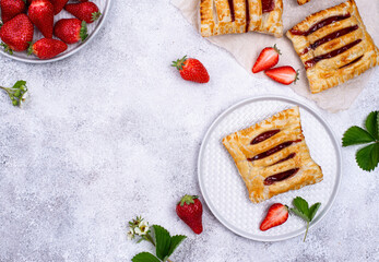 Sweet puff pastry cakes with strawberry