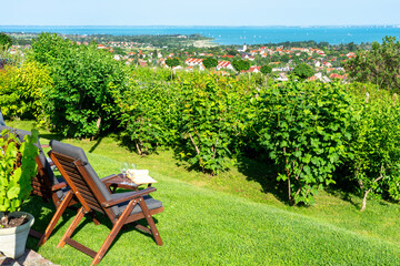 table and chairs over the Lake Balaton on the hill romantic date, picnic, eating in nature. Csopak...
