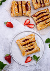 Sweet puff pastry cakes with strawberry