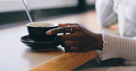 Coffee shop, relax and hands of woman by window with drink for calm, wellness and breakfast in...