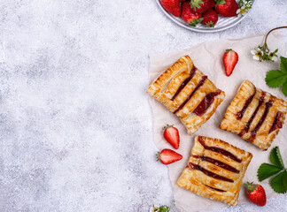 Sweet puff pastry cakes with strawberry
