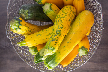 Yellow green leopard spotted zucchini. Vegetables on the table. vegetable marrow harvest. Food...