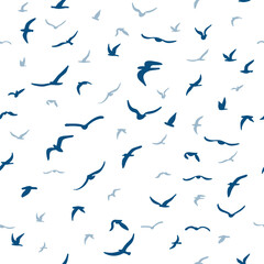 Flock of flying silhouette birds. Birds seamless pattern. White seagulls on a blue background.