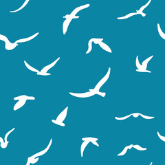 Flock of flying silhouette birds. Birds seamless pattern. White seagulls on a blue background.