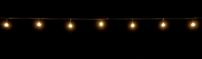 Vintage light bulb on dark background with copy space