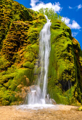 The “Dreimühlen Wasserfall“ formed from limestone deposits at the Ahbach creek in the Eifel,...