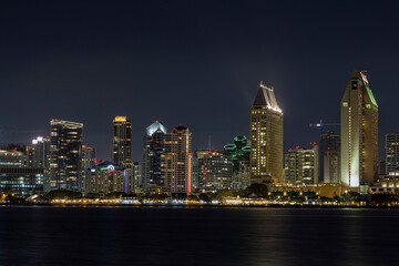 Fototapeta na wymiar the iconic and breathtaking skyline of San Diego downtown at night. With a thousand lights on the big Towers