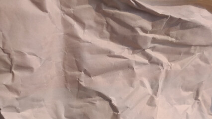 Brown crumpled paper texture,  wrinkled, abstract background.
