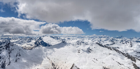 spring snow on mountain range over Bavona valley aerial, Switzerland