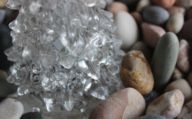 Curved Layers Of Transparent Crystal On Sea Stones Closeup View 
