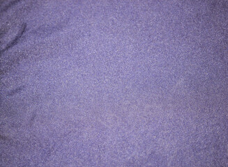 Flat purple-colored glossy fabric texture background