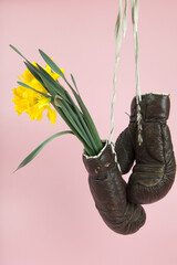 a pair of old boxing gloves hacked to become a vase