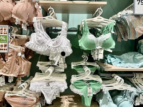 Russia, Moscow - May 14, 2024, a women's clothing and underwear store, a showcase with pastel-colored panties and bras, hang on the window. Aviapark Shopping Center.