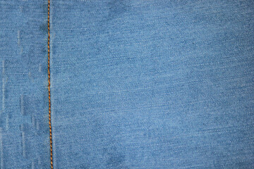 Close-up of blue jeans texture with. Denim textile background.
