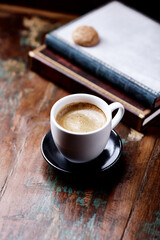 Cup of coffee on wooden background. Close up.