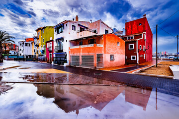 Houses reflected in a puddle in the old town of Villajoyosa