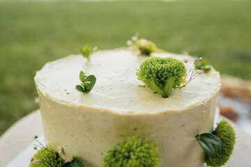 Elegant White Cake Adorned With Green Floral Details