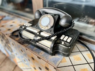 Vintage telephone near house. Selective focus