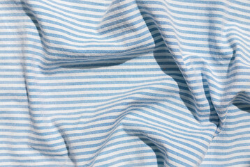 Blue striped organic cotton fabric background 