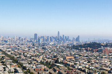 the iconic and breathtaking cityscape panoramic view from above a hill at bernal heights in san...