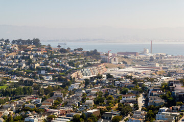 the iconic and breathtaking cityscape panoramic view from above a hill at bernal heights in san...