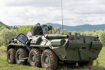 A BTR-80 armored personnel carrier in green camouflage