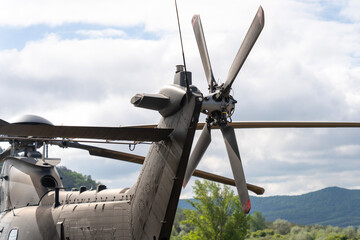 Rear rotor of a modern military transport helicopter painted black