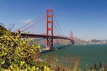 the unique and world famous Golden Gate Bridge at a clear sky sunny morning in san francisco