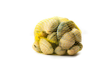 A yellow net bag full of fresh slimy clams isolated on a clean white background, illustrating fresh...