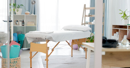 Therapy room, empty and a bed for physiotherapy, hospital exam or healthcare test. Clinic bedroom, medicine and gear and tools in an chiropractic or orthopedic office for a consultation or check