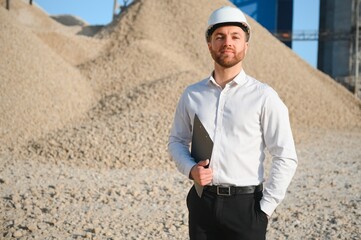 An engineer at a crushed stone or gravel plant. Stone mining