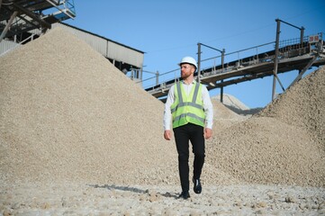An engineer at a crushed stone or gravel plant. Stone mining
