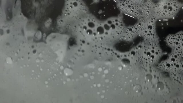 Washing machine cycle closeup with foam