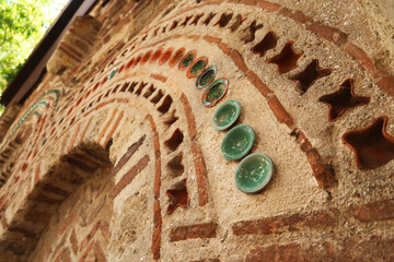 Rows of tiles and bricks decorate the elaborate facade of the Church of St., Saint Paraskevi, Sveta...