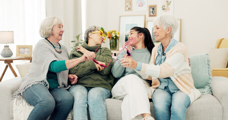 Happy, glasses and senior women face on the living room sofa for fun, playing and comedy. Smile,...