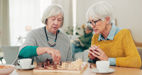 Senior woman, friends and playing chess on table for social activity, decision or strategy game at...