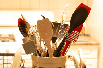 kitchen utensils placed in a crock 