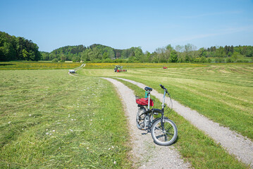 bike route around lake Seehamer See through mowed field, rural scenery