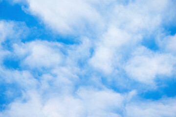 Blue sky with a layer of white clouds on a sunny day, natural background photo