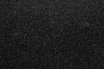 A sheet of black cardboard texture as background