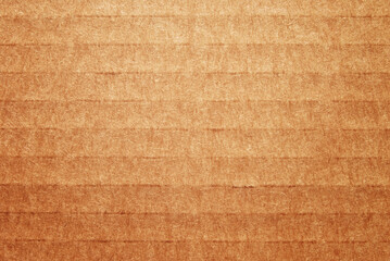 A sheet of brown corrugated cardboard texture as background