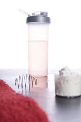 Dietary Supplement and Towel: Essentials for Fitness Regimen