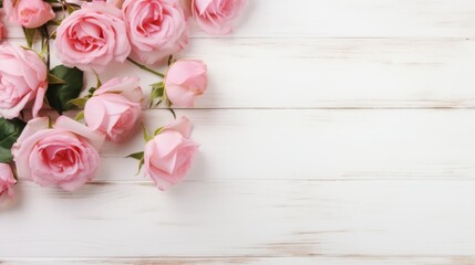 A serene and romantic display of pastel pink roses arranged neatly on a whitewashed wooden background