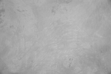 Naklejka premium Close-up image of a textured concrete wall, highlighting the rough surface and details in monochrome.