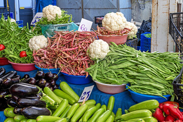 Fresh organic colorful vegetables sold outside on a market stall