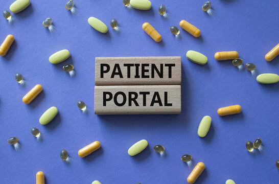 Patient Portal symbol. Concept word Patient Portal on wooden blocks. Beautiful purple background with pills. Medicine and Patient Portal concept. Copy space