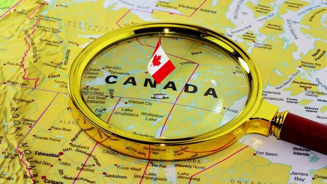 Canada Map, video 4K. Canadian Flag on the Map of Canada under magnifying glass
